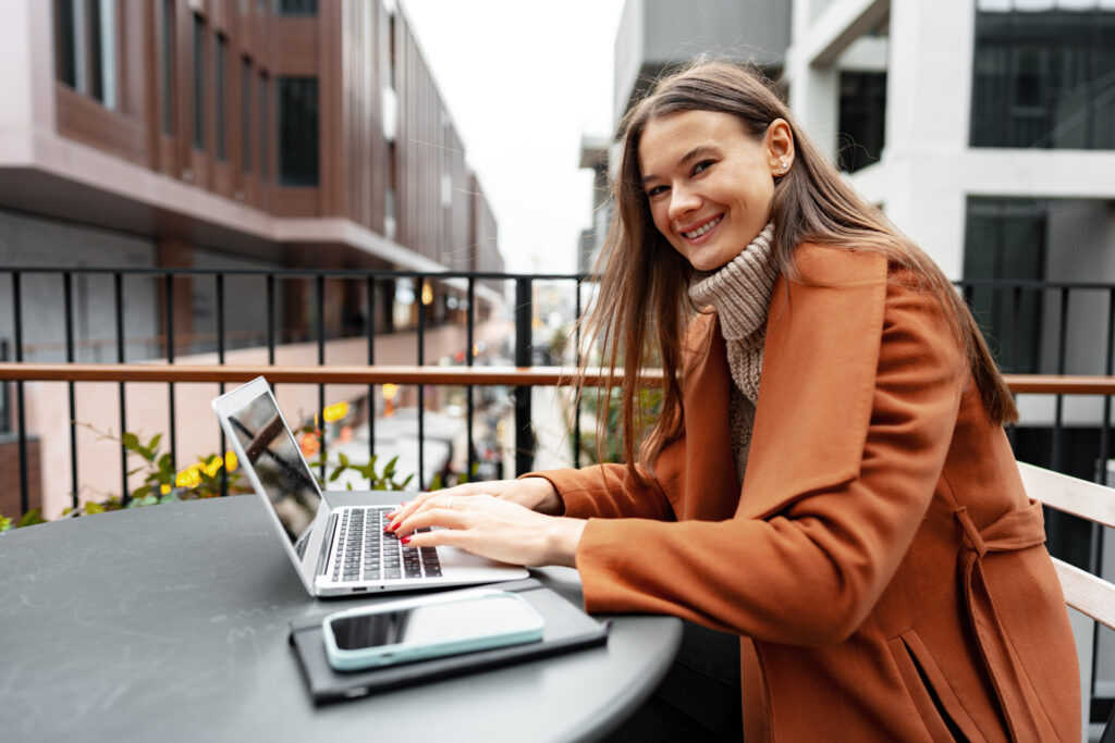 young woman working with her laptop sitting at the 2023 02 21 01 48 18 utc 1